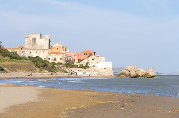 Fototapeta na wymiar The beautiful castle of Falconara in Sicily seen from the sand beach. It was a sunny summer day in this nice hidden spot located near Butera, Caltanissetta.