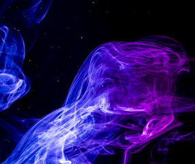 Colored smoke on black background