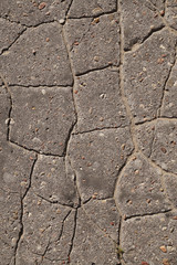 Cracked, gray destroyed area, road, asphalt, background.