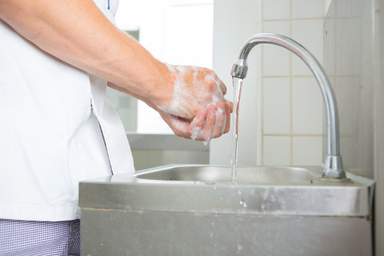 Closeup of hands being washed