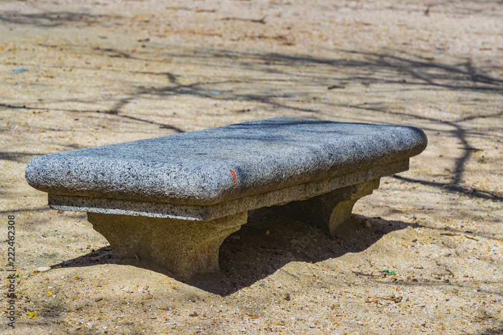 Wall mural stone large wide bench in a deserted autumn park