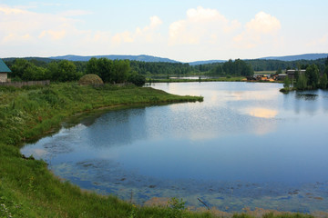 The village on the shore of the pond