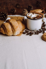 Winter and autumn hot drink. Hot chocolate or cocoa with marshmallow , cookies and spices on white and wooden background.