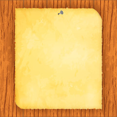 Vector image of a realistic old sheet of paper on a wooden background