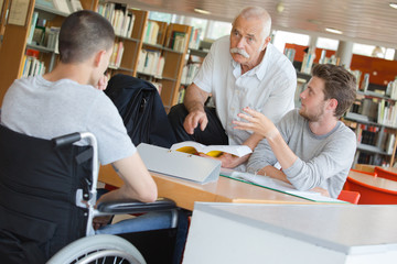 students and teacher in the library