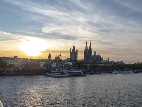 City of Colonge with view overr the river Rhine to the Kathedral and old town at sunset