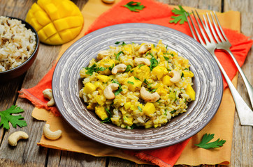 Curry chicken rice with mango and parsley
