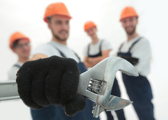 closeup. the wrench in the hands of the builders
