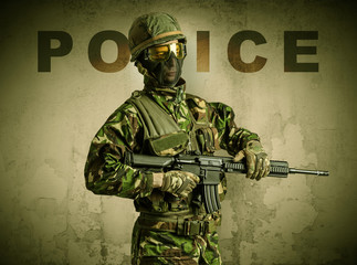 Uniformed armed soldier with damaged wall background
