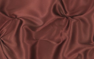 Chocolate-colored satin, drapery, textile background