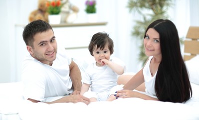 A young family with young children to bed in the bedroom
