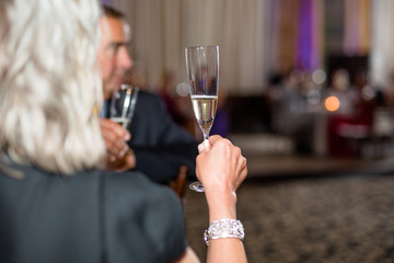 Woman Holding Glass of Champagne; Champagne Toast