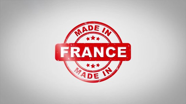 Made In FRANCE Signed Stamping Text Wooden Stamp Animation. Red Ink on Clean White Paper Surface Background with Green matte Background Included.