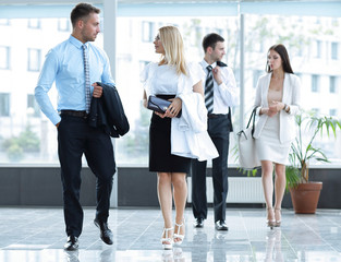 business people standing in the lobby of the modern office.