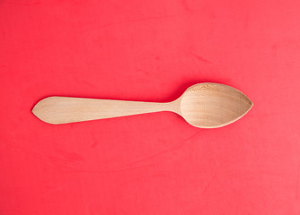wooden spoon in color background