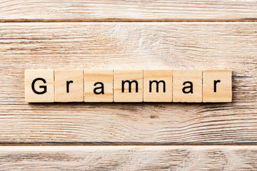 grammar word written on wood block. grammar text on table, concept
