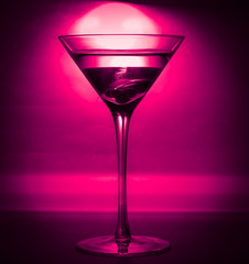 a glass of martini. close-up. in club