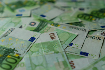texture of many lying hundred euro banknotes, european union money