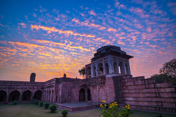 Mandu India, afghan ruins of islam kingdom, mosque monument and muslim tomb. Colorful sky at...