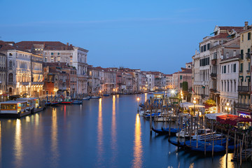 Fototapeta na wymiar Grand Canal in Venice illuminated in the early morning, clear blue sky in summer in Italy