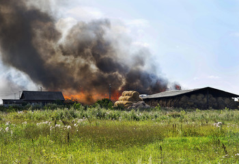 Fototapeta na wymiar fire in an agricultural warehouse