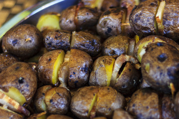 shish kebab from potatoes and slices of fat