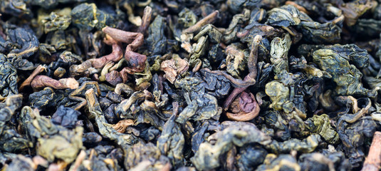 Leaves of green tea - food background. Macro with shallow depth of field.