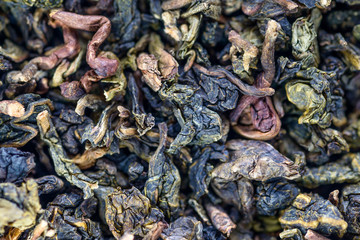 Leaves of green tea - food background. Macro with shallow depth of field.