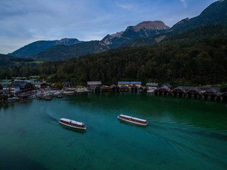 Naklejka na ściany i meble königssee waterfall alps bayern forrest drone aerial shot nature wanderlust boat mountains harbour