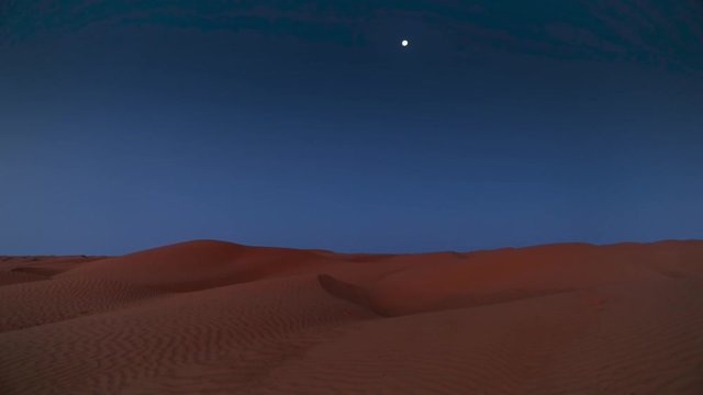 early morning with moon in the desert