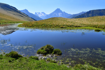 Naklejka na ściany i meble Russia, Caucasus, Arkhyz. Small unnamed lake on the plateau Gabulu in summer