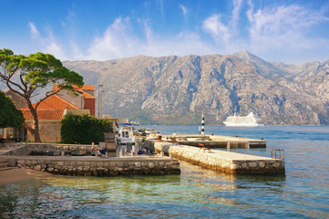 Sunny Mediterranean landscape. Montenegro, Adriatic Sea, Bay of Kotor. View of  Prcanj town