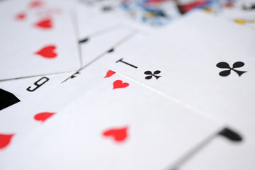 Background of playing cards scattered on a table close up