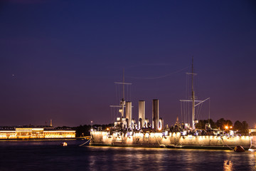 Ship Aurora in St. Petersburg, Russia, at night in June. The Neva River in St. Petersburg. Night city.