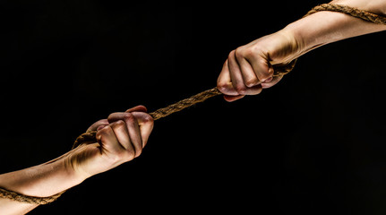 Rescue, help, helping gesture or hands. Conflict, tug of war. Two hands, helping hand, arm,...