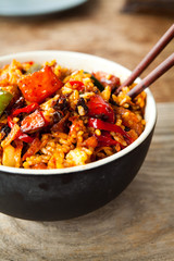 Asian Style Vegan Fried Rice -  spicy oriental dish, cooked with preserved black bean sauce, vegetables potato, red pepper, green beans, spring onions.