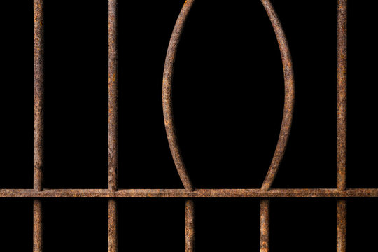 Broken old prison rusted metal bars on black background, concept of escape