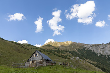 Fototapeta na wymiar alpine hut krumpenalm beneath Eisenerzer Reichenstein, a mountain in the Ennstal Alps in the Austrian federal state of Styria