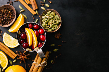 Mulled wine with fruits in old vintage metal cup
