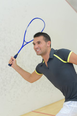 professional player playing tennis in indoor court