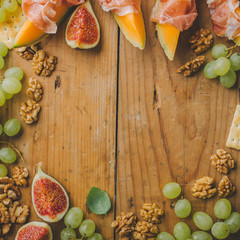 Mediterranian appetizers on old wooden table