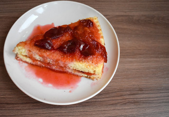Cake with jam on a white plate.
