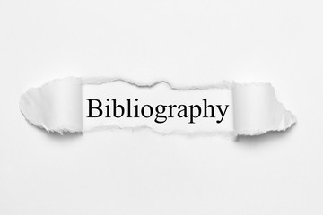 Bibliography on white torn paper