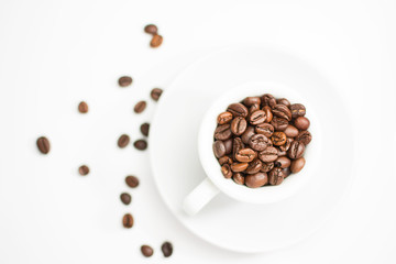 coffee cup full of roasted coffee beans
