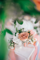 Table set for wedding or another catered event dinner. Catering in restaurant for wedding party. Served tables with pink and red flowers. 