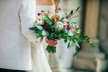 Wedding flowers, bridal bouquet closeup. Decoration made of roses, peonies and decorative plants, close-up, selective focus, nobody, object