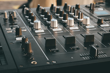 DJ turntable deck mixer close up, sound equipment, audio control panel for party, night clubs or...