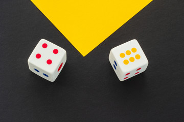 Dice on a black and yellow background