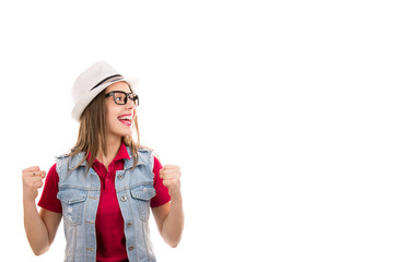 woman in hat and glasses with fists up feeling excited looking super thrilled