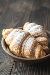 Croissants with icing on the plate